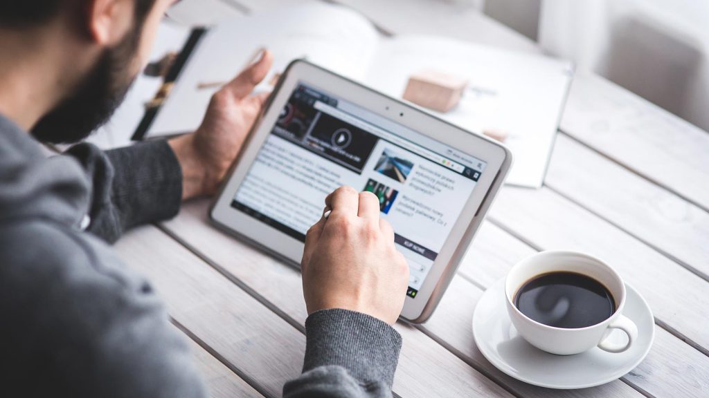 Our platform is now available on every device man coffee cup pen 1024x576 - Our platform is now available on every device